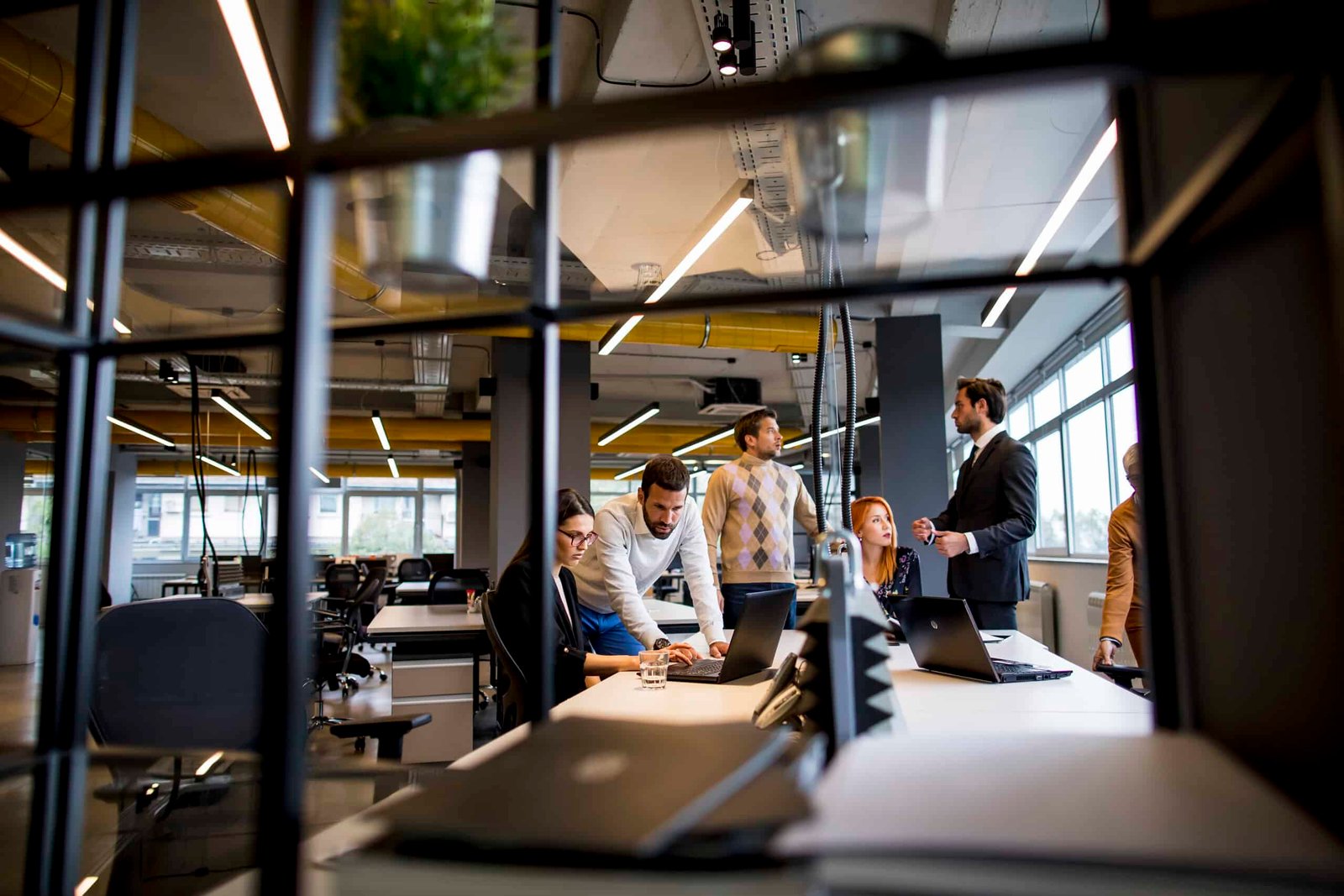 Group of young business people are working together on a laptop